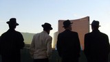 Frank Sinatra's famed Rat Pack is still enjoying encores in Las Vegas, thanks to tribute shows like "Sandy Hackett's Rat Pack Show." The cast of Hackett's show strikes a shadowy pose on the Vegas strip in this photo, taken in front of Steve Wynn's Encore resort.
